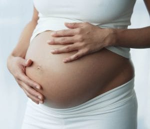 Pregnant belly - twin vs singleton pregnancy.