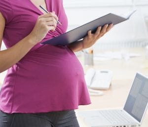 Pregnant woman at work. When to stop working when pregnant with twins.