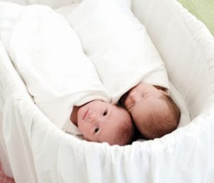 Twin babies in bassinet. Twin sleep training tips.