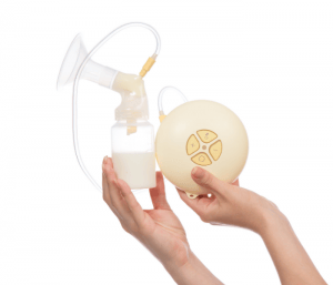 Person holding an electric breast pump. How to wean off pumping.