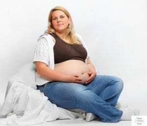 Pregnant mom who is overweight. This article discusses what to expect from a plus size twin pregnancy.