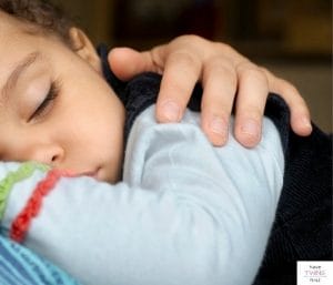 Toddler sleeping on his stomach. This article discusses the best toddler sleep sacks.